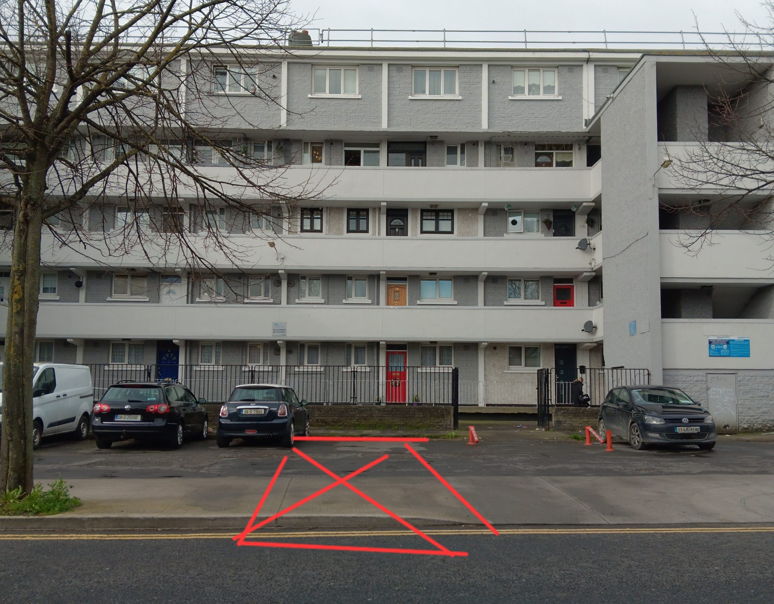Image of Pimlico flats in Dublin 8 with a overlay of a red marking on the ground in front which symbolises where James Connolly's house once stood.