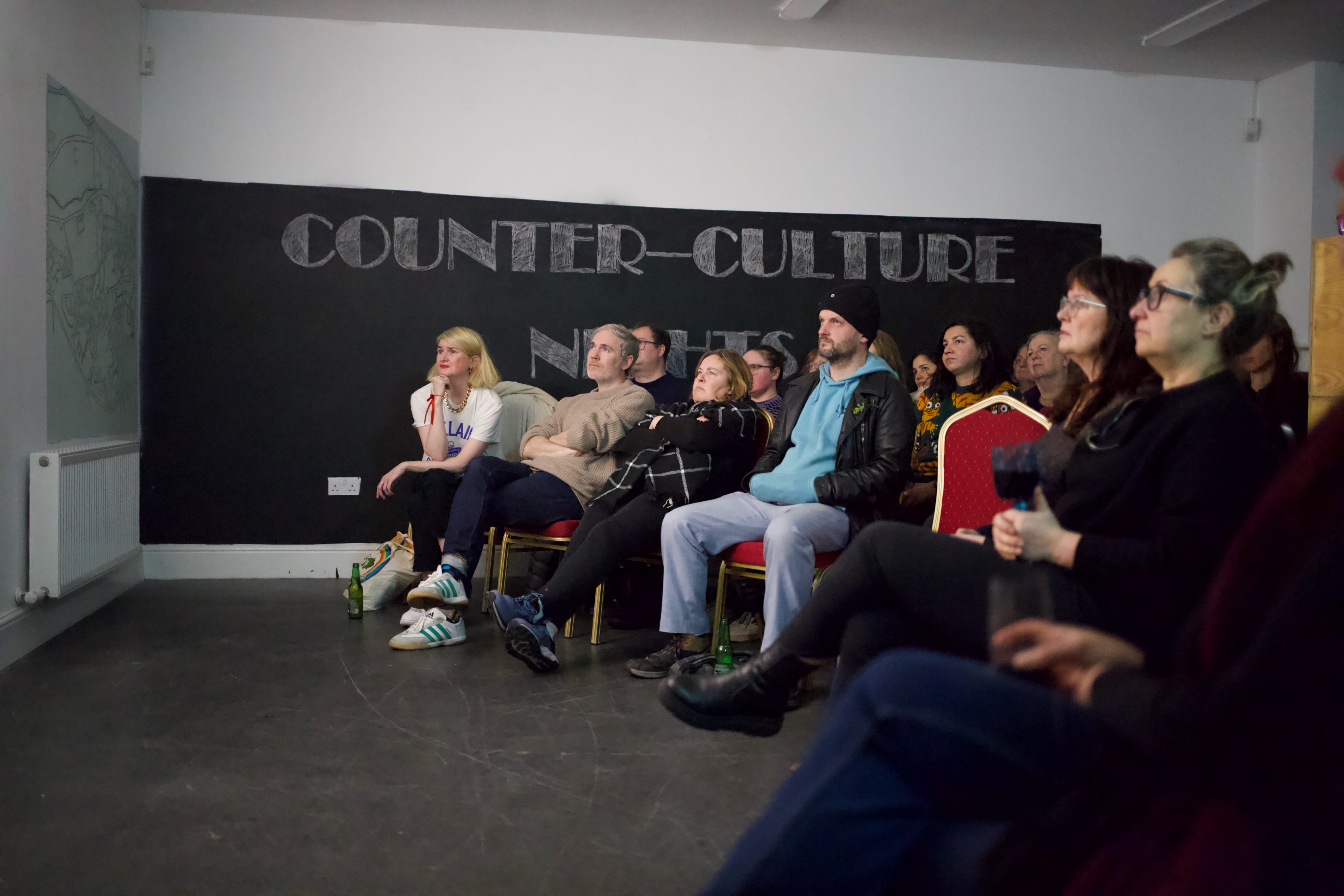 Image of audience watching films in studio 468 as part of Counter Culture Night event